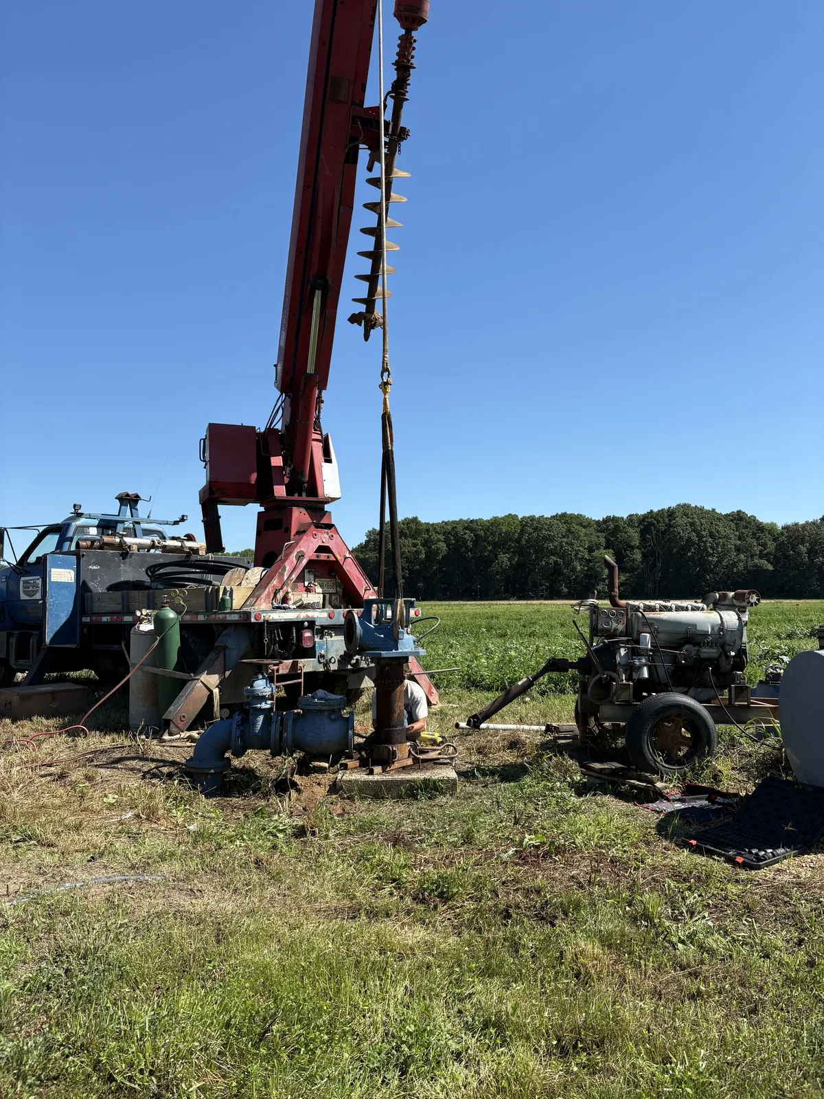 Rig and test pump set up over a farm well